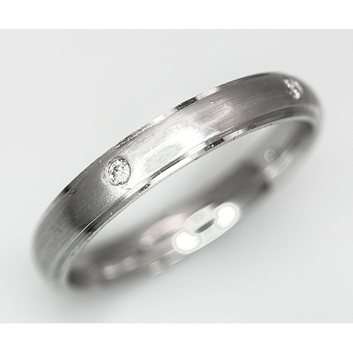 86 - AN 18K WHITE GOLD DIAMOND SET BAND RING. 3.63G TOTAL WEIGHT. SIZE O. Ref: A/S 1172