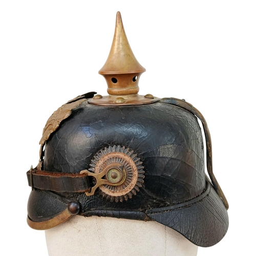 92 - A 1891 Pattern Prussian Pickelhaube. With Wappen plate, cockcades, chinstrap, spike and liner. Unit ... 