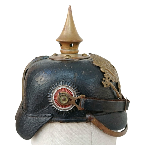 92 - A 1891 Pattern Prussian Pickelhaube. With Wappen plate, cockcades, chinstrap, spike and liner. Unit ... 