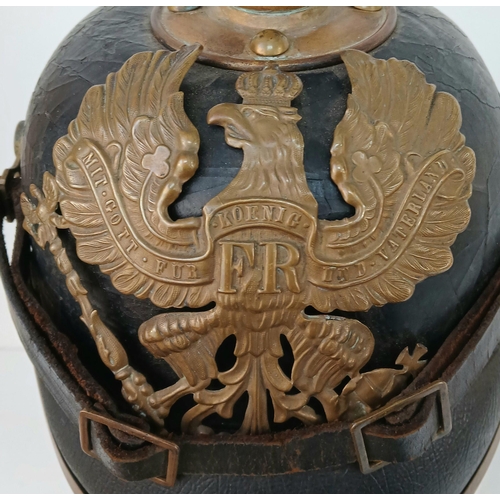 92 - A 1891 Pattern Prussian Pickelhaube. With Wappen plate, cockcades, chinstrap, spike and liner. Unit ... 