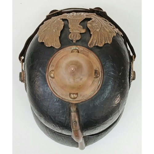 92 - A 1891 Pattern Prussian Pickelhaube. With Wappen plate, cockcades, chinstrap, spike and liner. Unit ... 