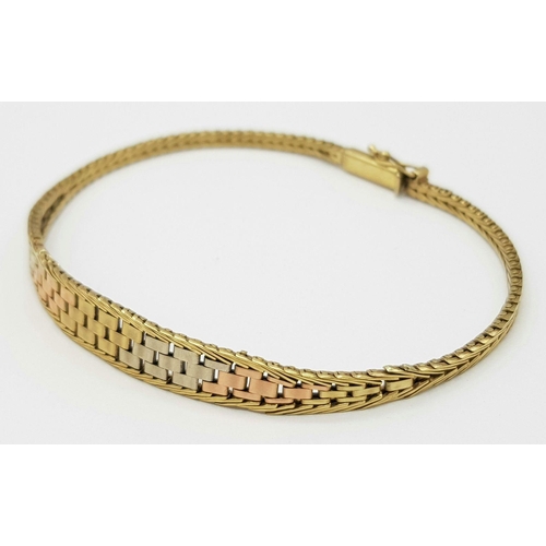 598 - A 3 COLOURED GOLD GRADUATED WOVEN BRACELET IN 9K GOLD .     8.2gms     20cms