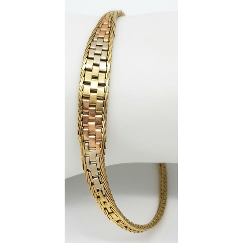 598 - A 3 COLOURED GOLD GRADUATED WOVEN BRACELET IN 9K GOLD .     8.2gms     20cms