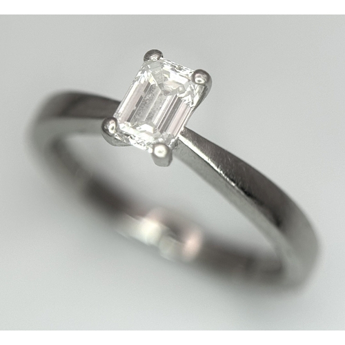 402 - An Emerald Cut Diamond Solitaire Ring. This 0.41ct diamond (VVS/F) is set in 950 Platinum. Size J 1/... 