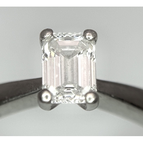 402 - An Emerald Cut Diamond Solitaire Ring. This 0.41ct diamond (VVS/F) is set in 950 Platinum. Size J 1/... 