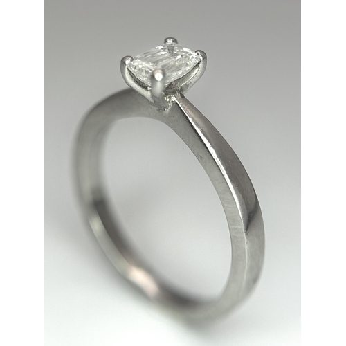 402 - An Emerald Cut Diamond Solitaire Ring. This 0.41ct diamond (VVS/F) is set in 950 Platinum. Size J 1/... 