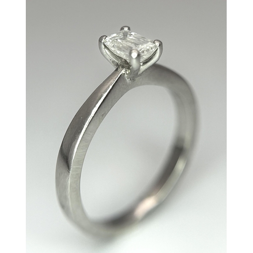 402 - An Emerald Cut Diamond Solitaire Ring. This 0.41ct diamond (VVS/F) is set in 950 Platinum. Size J 1/... 