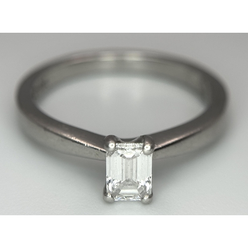 402 - An Emerald Cut Diamond Solitaire Ring. This 0.41ct diamond (VVS/F) is set in 950 Platinum. Size J 1/... 