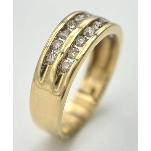 409 - An 18K Yellow Gold Two Row Diamond Ring. 18 channel set diamonds - 0.75ctw approx. Size P 1/2. 5.2g ... 