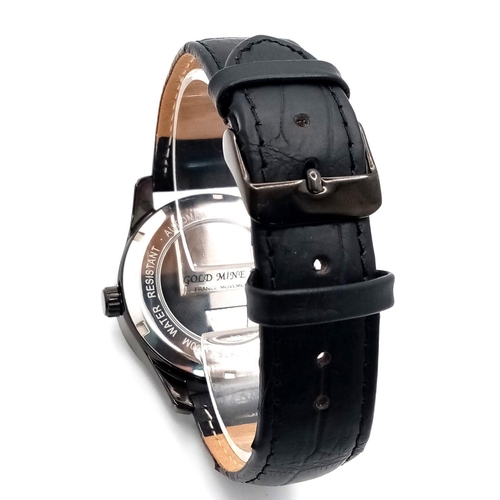 986 - An Adam and Eve Automatic Erotic Watch - Gold mine 18. 
Black leather strap. Steel and ceramic case ... 