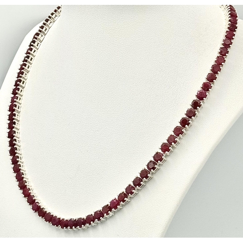 235 - A 925 silver ruby gemstone tennis necklace. Round-cut ruby stones. Total length: 45.5cm. Total weigh... 