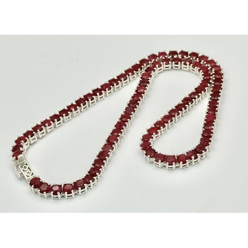 235 - A 925 silver ruby gemstone tennis necklace. Round-cut ruby stones. Total length: 45.5cm. Total weigh... 