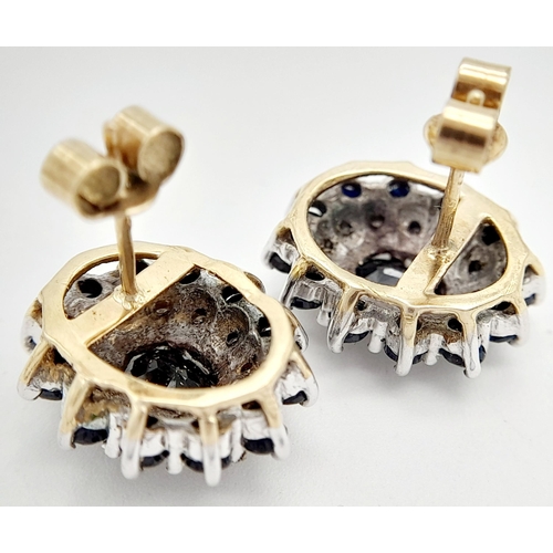 282 - A PAIR OF 9K YELLOW GOLD DIAMOND & SAPPHIRE CLUSTER STUD EARRINGS. 4.2G TOTAL WEIGHT. APPROX. 1.4CM ... 