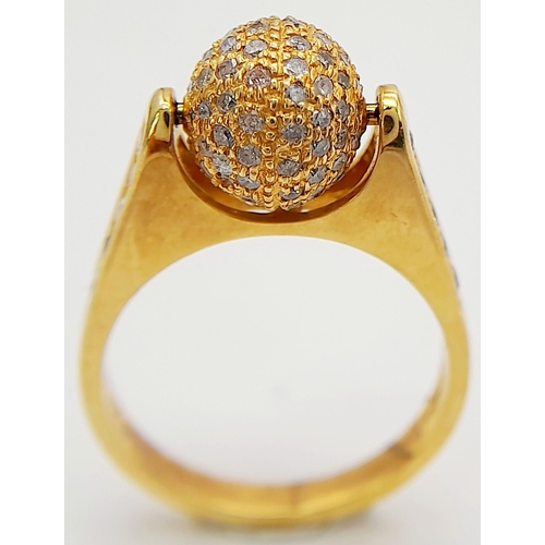 30 - AN 18K YELLOW GOLD DIAMOND SET SPINNING BALL TOP RING. 0.92CT. 6.25G TOTAL WEIGHT. SIZE M. Ref: TAN ... 