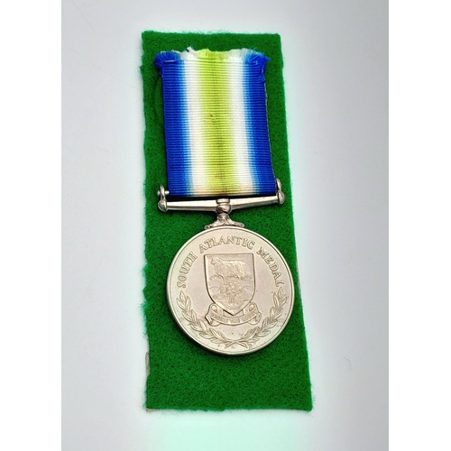 31 - A British South Atlantic Medal (Falklands) with Rosette. Awarded to PO118220 MNE2 I.M Simpson 45 Com... 