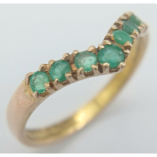 359 - AN 18K YELLOW GOLD EMERALD SET BAND RING. 1.83G TOTAL WEIGHT. SIZE K AND 1/2. Ref: SC 1054