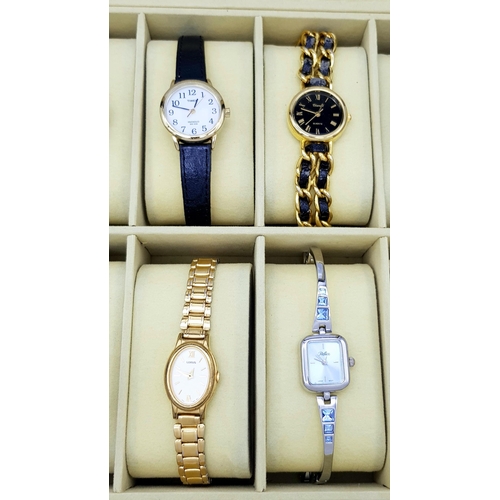 396 - A Ten Watch Display Box Containing Ten Ladies  Watches Comprising: 1) A Seiko Model 6530-5500. 2) An... 