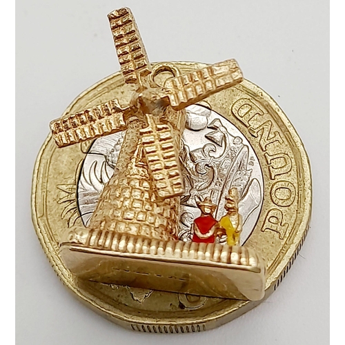 429 - A 9K YELLOW GOLD WINDMILL CHARM WITH MOVING PARTS. 3.67G TOTAL WEIGHT. APPROX. 1.8CM IN HEIGHT AND 1... 