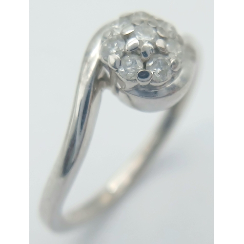 555 - A 9K WHITE GOLD DIAMOND TWIST RING. 2G IN WEIGHT. SIZE M. Ref: SC 1027