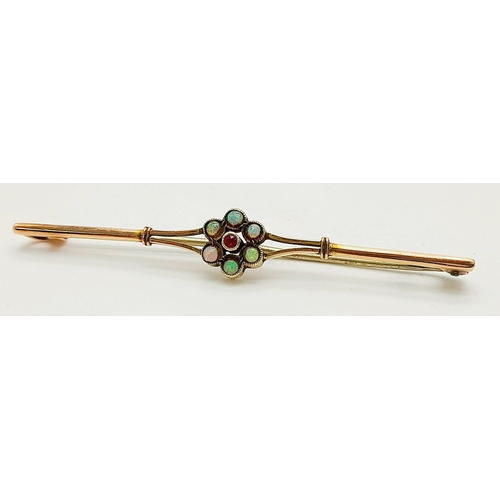 693 - Traditional Vintage 9 carat GOLD BAR BROOCH. Having OPALS and RUBY centre detail. 2.0 grams. 5.5 cm