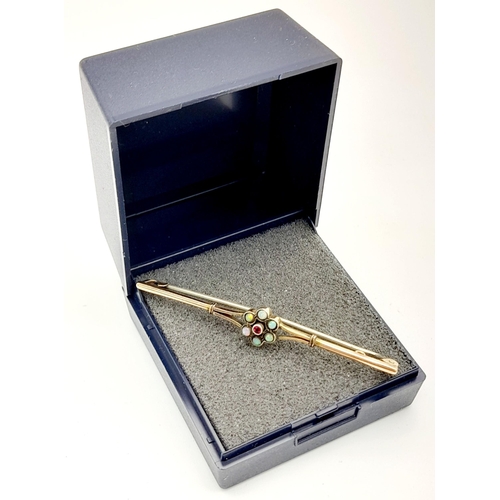 693 - Traditional Vintage 9 carat GOLD BAR BROOCH. Having OPALS and RUBY centre detail. 2.0 grams. 5.5 cm