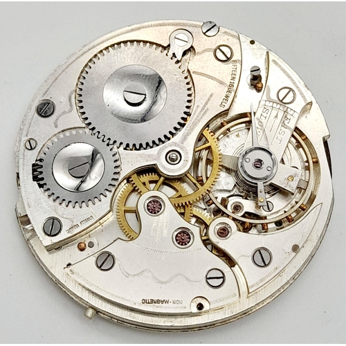 724 - A NON MAGNETIC 15 JEWELLED LEVER AUTOMATIC POCKET WATCH MOVEMENT WITH DIAL FOR PARTS / SPARES. Ref: ... 