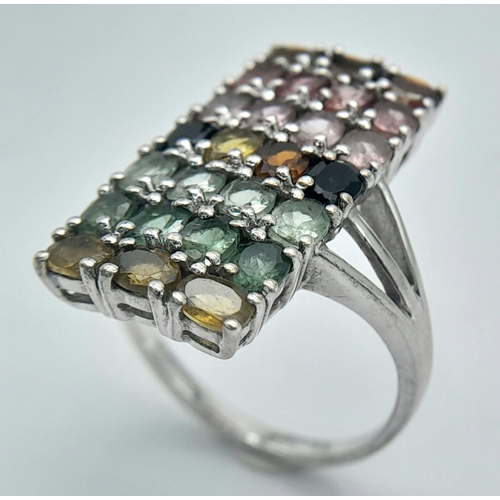 957 - A Sterling Silver Multi-Semi Precious Gemstone Set Ring Size S. The Ring Measures 2.7cm Length. Gros... 