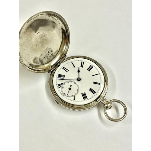 670 - An Antique silver full hunter pocket watch, working but missing glass .