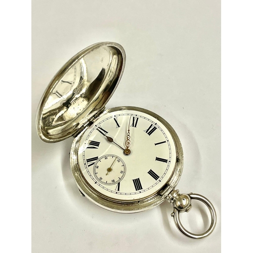 692 - An Antique gents silver full hunter pocket watch. In Working order, but missing glass.