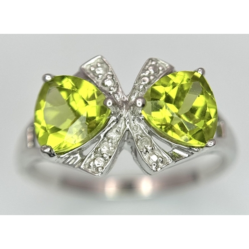 1137 - A Sterling Silver Peridot and Diamond Set Ring Size L. The Crown Measures 9mm Wide and the Ring Weig... 