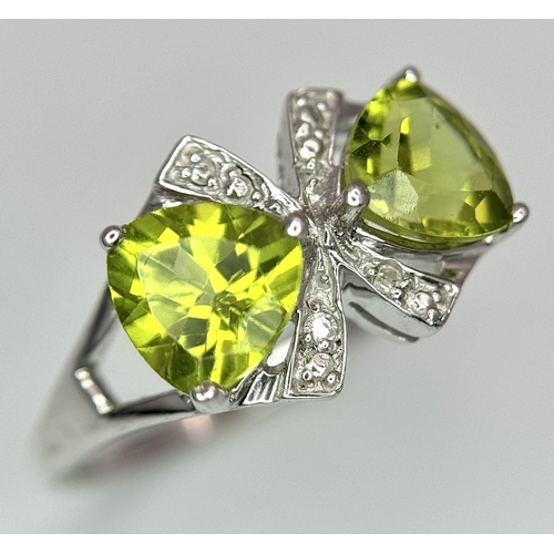 1137 - A Sterling Silver Peridot and Diamond Set Ring Size L. The Crown Measures 9mm Wide and the Ring Weig... 