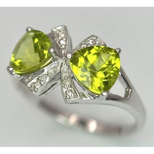 1137 - A Sterling Silver Peridot and Diamond Set Ring Size L. The Crown Measures 9mm Wide and the Ring Weig... 