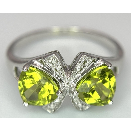 1137 - A Sterling Silver Peridot and Diamond Set Ring Size L. The Crown Measures 9mm Wide and the Ring Weig... 