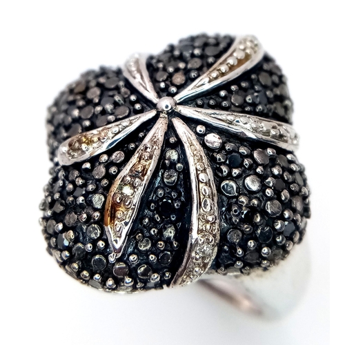 1193 - A Vintage Sterling Silver Hematite and Diamond Set Cluster Ring Size O. The ring Measures 2.2cm Wide... 