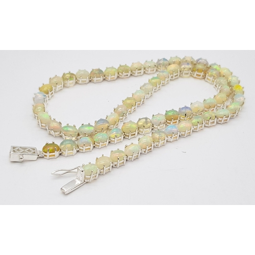 200 - A 925 silver opal gemstone tennis necklace. Oval-cut opal stones. Total length: 46cm. Total weight: ... 