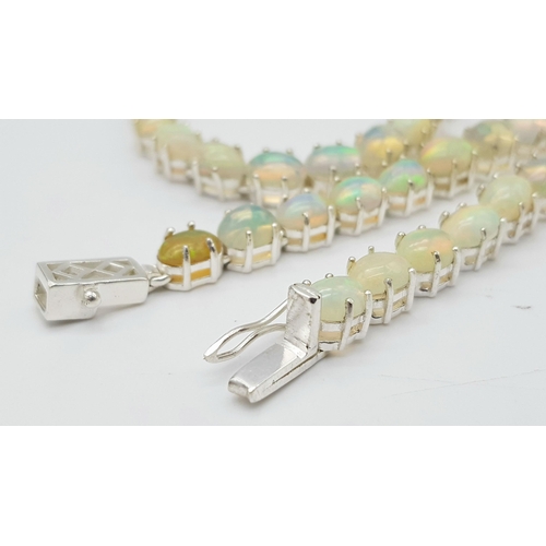 200 - A 925 silver opal gemstone tennis necklace. Oval-cut opal stones. Total length: 46cm. Total weight: ... 