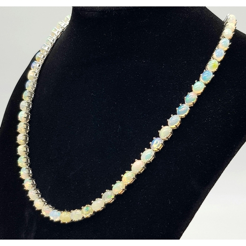 200 - A 925 silver opal gemstone tennis necklace. Oval-cut opal stones. Total length: 46cm. Total weight: ... 