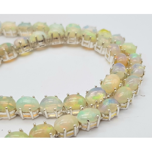 200 - A 925 silver opal gemstone tennis necklace. Oval-cut opal stones. Total length: 46cm. Total weight: ... 