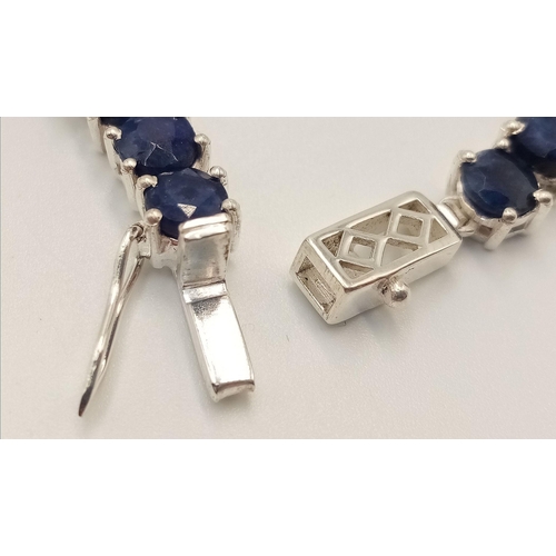 228 - A 925 sterling silver blue sapphire gemstone tennis necklace. Round-cut blue sapphire stones. Total ... 