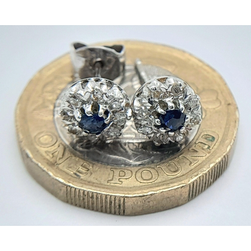 576 - A PAIR OF 9K WHITE GOLD DIAMOND & SAPPHIRE STUD EARRINGS. 1.34G TOTAL WEIGHT. needs one new butterfl... 