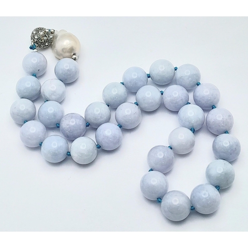 643 - An Aquamarine Large Beaded Necklace with Baroque Pearl Interrupter. Beads - 14mm. Necklace length - ... 