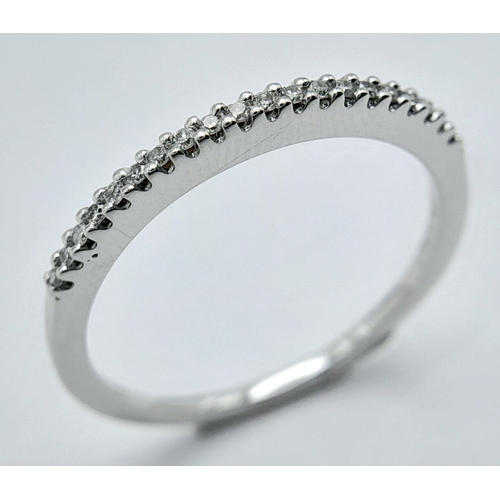 660 - A 9K WHITE GOLD DIAMOND BAND RING 0.10CT. 1.6G TOTAL WEIGHT. SIZE P. Ref: SC 1031