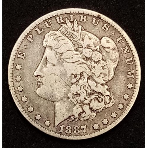 698 - A  Fine Condition 1887 Dated Silver Morgan Dollar- 26.34 Grams. Graded on the Sheldon Scale.