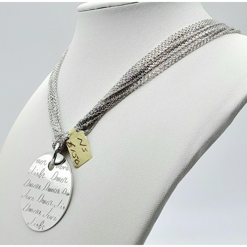 703 - A STERLING SILVER MULTI STRAND NECKLACE  WITH THE WORD LOVE IN VARIOUS LANGUAGES. 39.5G TOTAL WEIGHT... 