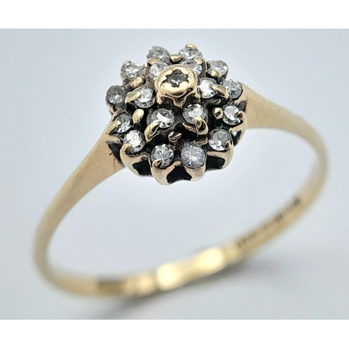 717 - A 9K YELLOW GOLD DIAMOND SET CLUSTER RING. 1.1G TOTAL WEIGHT. SIZE L. Ref: J S 1002