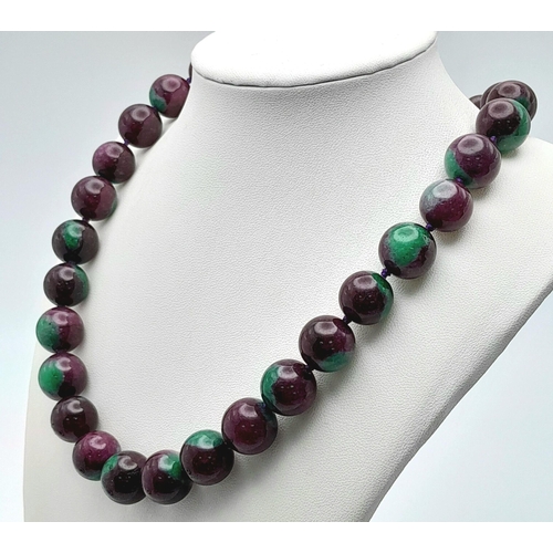 938 - A Large Beaded Ruby Zoisite Necklace. 14mm beads. Necklace length - 42cm.