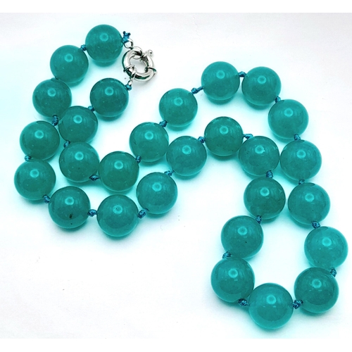 945 - A Large Blue Jade Beaded Necklace. 14mm beads. Necklace length - 46cm.