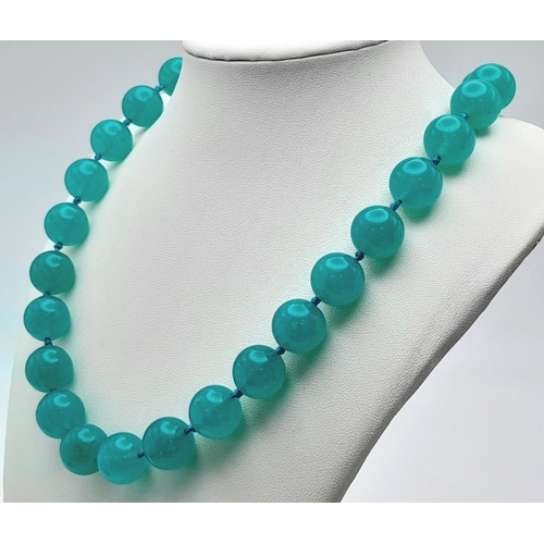 945 - A Large Blue Jade Beaded Necklace. 14mm beads. Necklace length - 46cm.