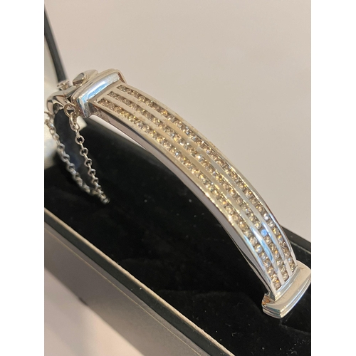 126 - Magnificent DIAMOND set WHITE GOLD BANGLE. Consisting a 9 CARAT W/GOLD BANGLE with  1.5 CARAT of CHA... 