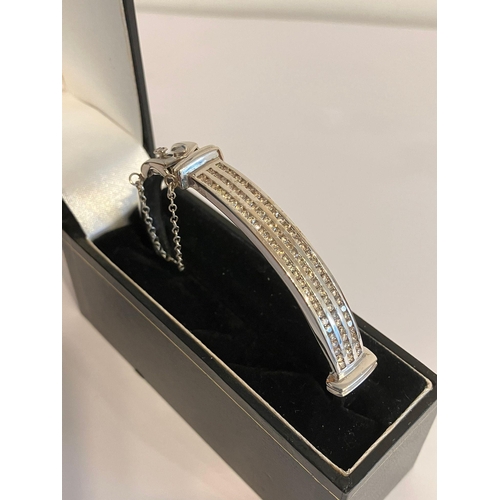 126 - Magnificent DIAMOND set WHITE GOLD BANGLE. Consisting a 9 CARAT W/GOLD BANGLE with  1.5 CARAT of CHA... 